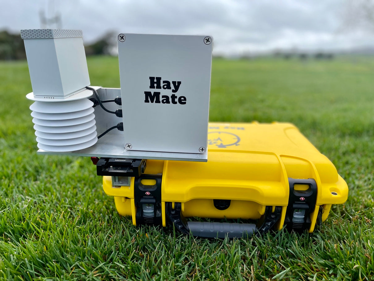 HayMate Medium with temperature, humidity and rainfall sensors beside its yellow case
